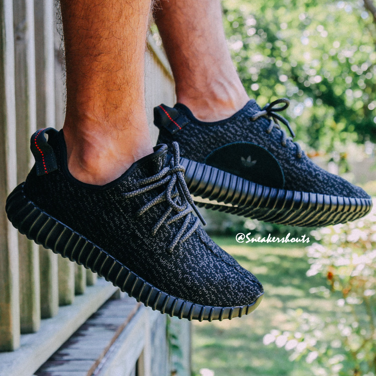 black yeezy on feet