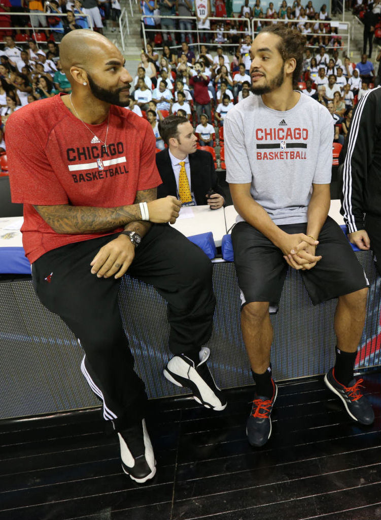 Carlos Boozer wearing Air Jordan XIII 13 Retro White/Black; Joakim Noah adidas Energy Boost