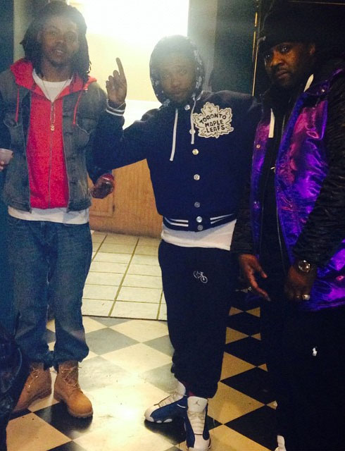 Currensy wearing Air Jordan XIII 13 Flint