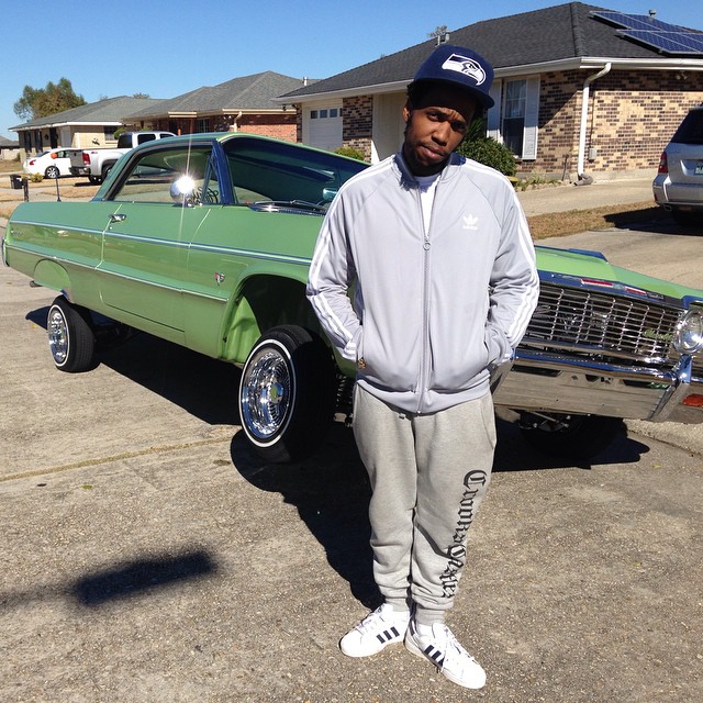 Currensy wearing adidas Originals Superstar