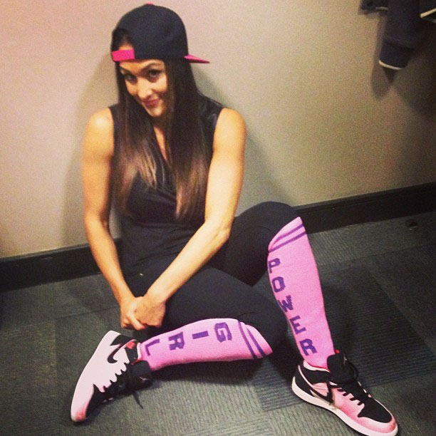 Nikki Bella wearing Air Jordan 1 Mid GS Ion Pink