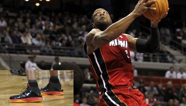 Dwyane Wade wears Black/Red/Orange Air Jordan 2011 PE against Pistons