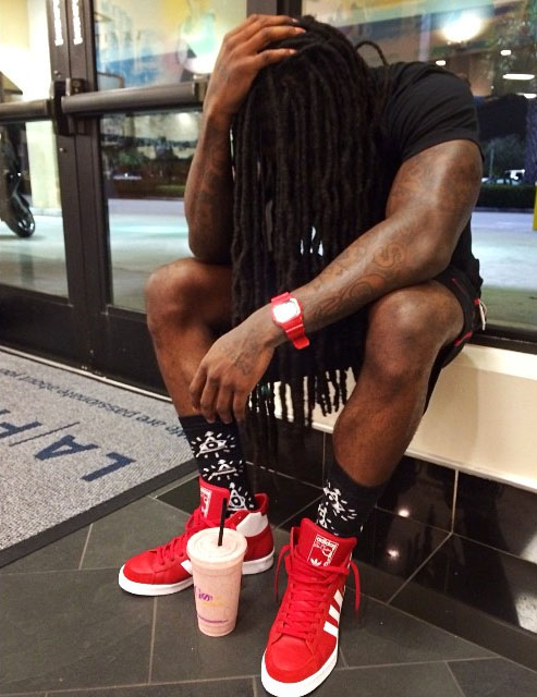 Ace Hood wearing adidas Originals Jabbar Hi Red