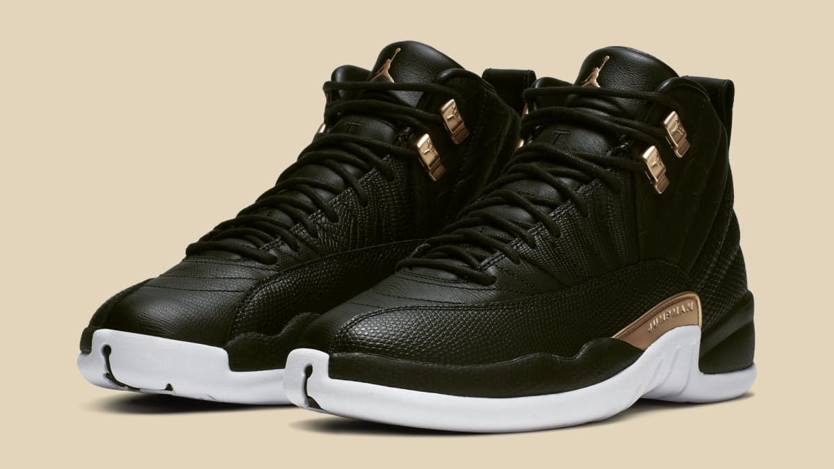 gold and white and black jordans