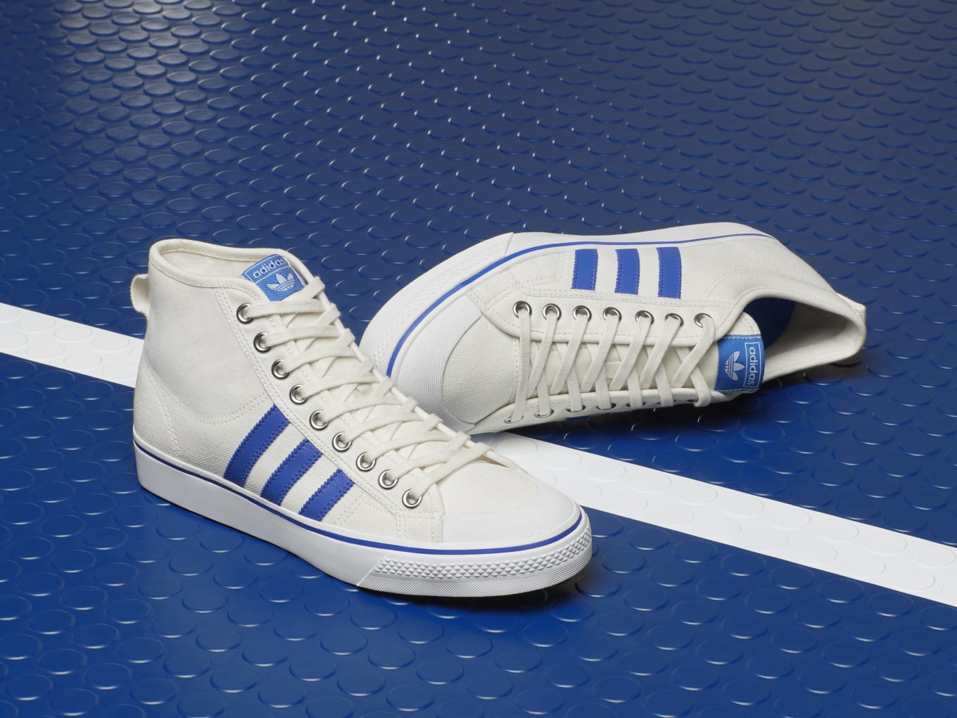 adidas originals nizza canvas trainers in white and blue