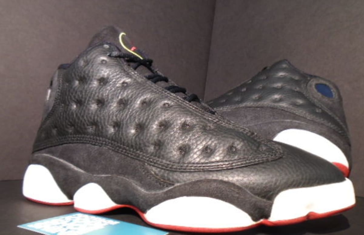 black and turquoise jordans 13