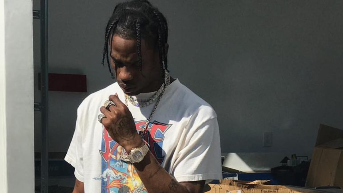 Travis Scott Wearing Black Kaws X Air Jordan 4 Sole Collector