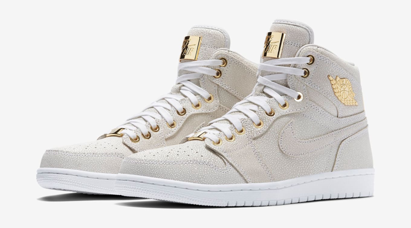 gold and white air jordans