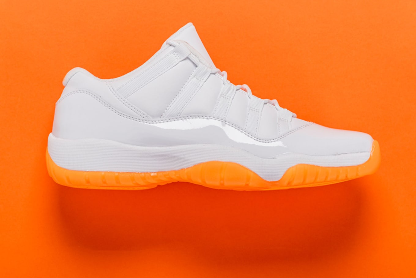 orange and white jordan 11