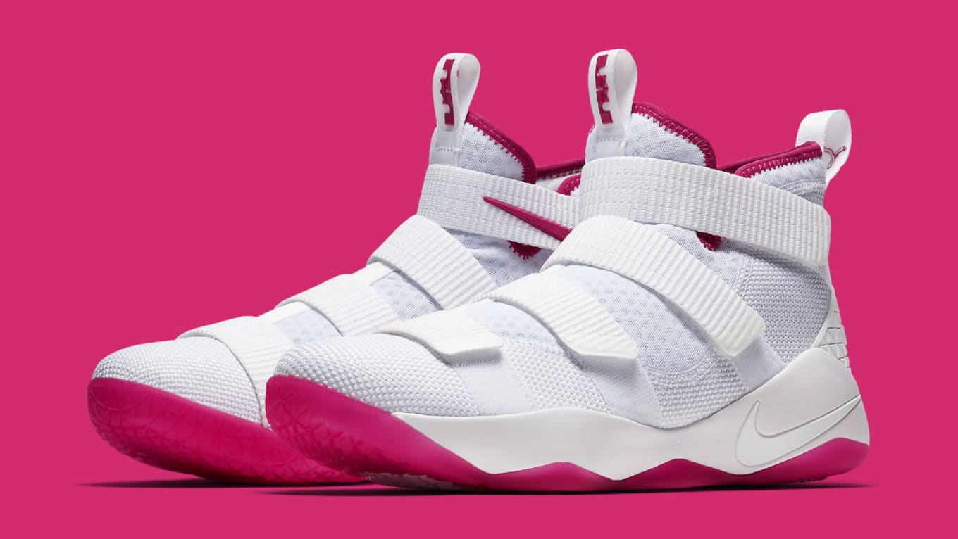 white and pink lebrons