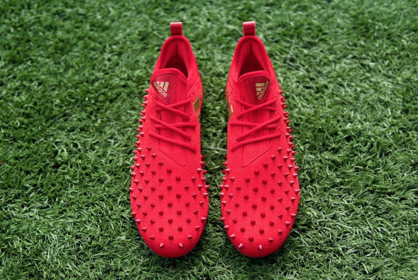 red and gold adidas football cleats