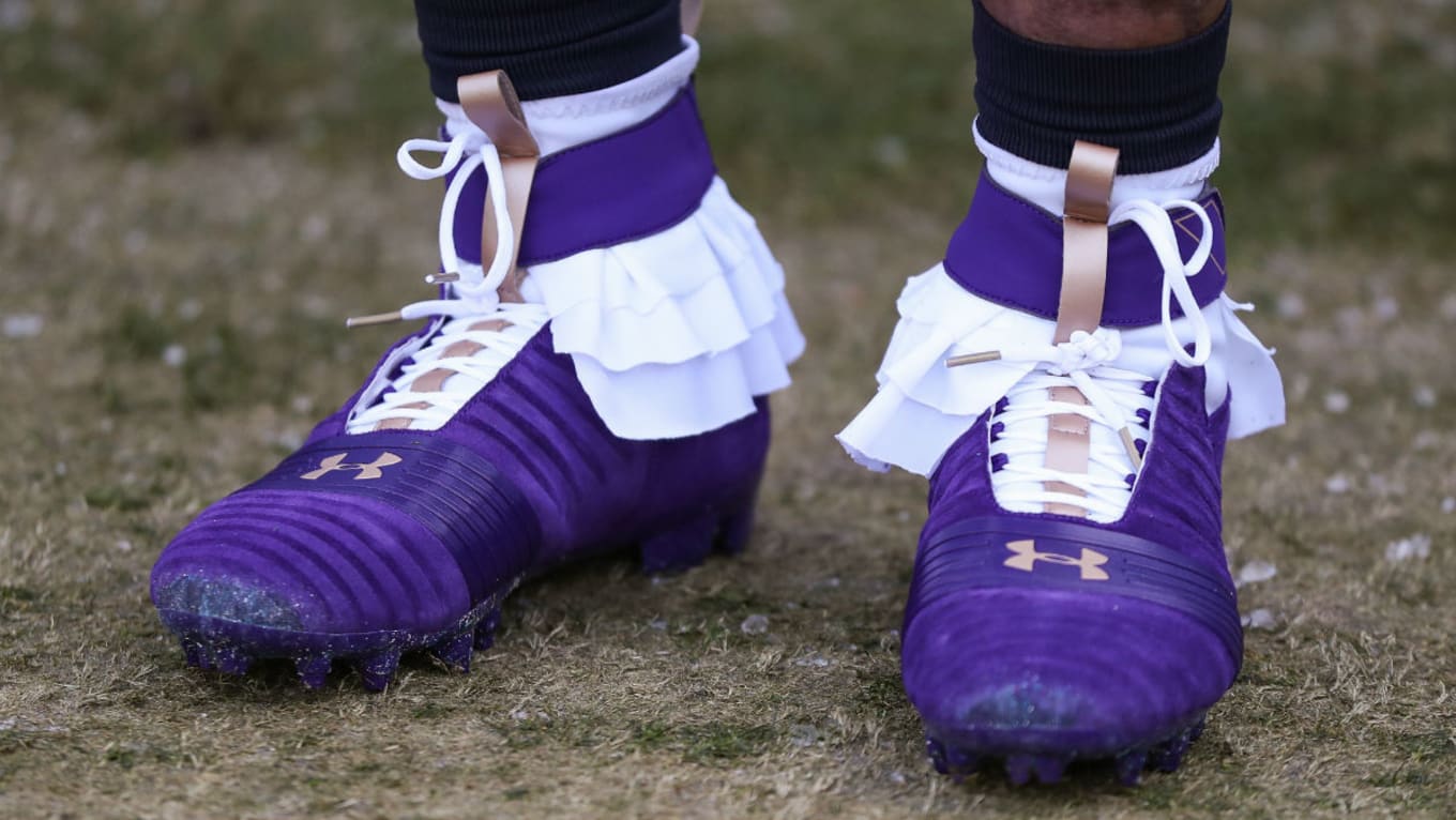 gold and purple football cleats