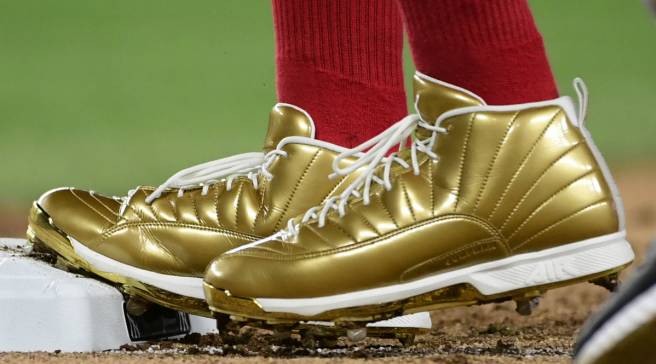 gold jordan cleats