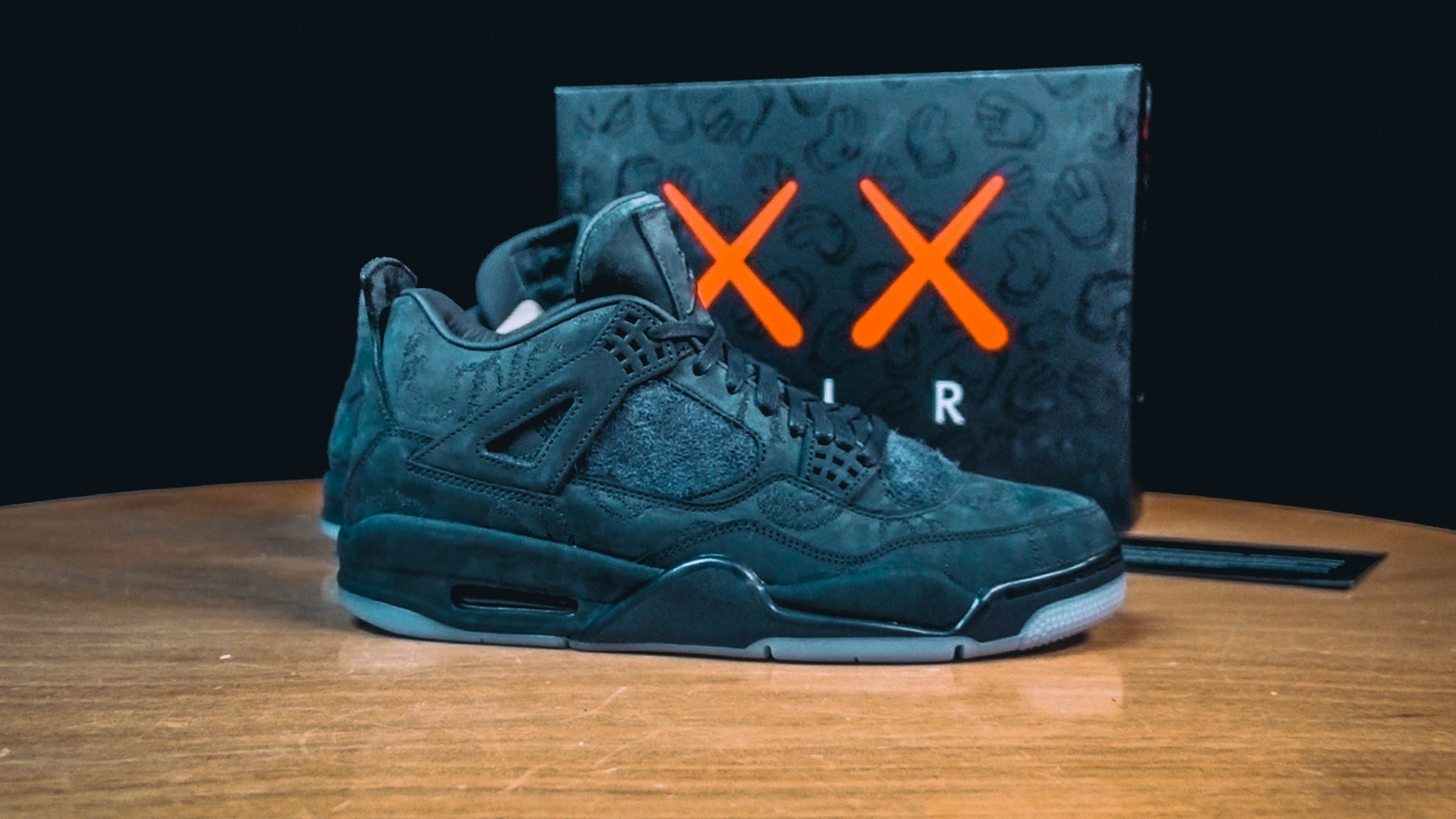 black kaws 4s