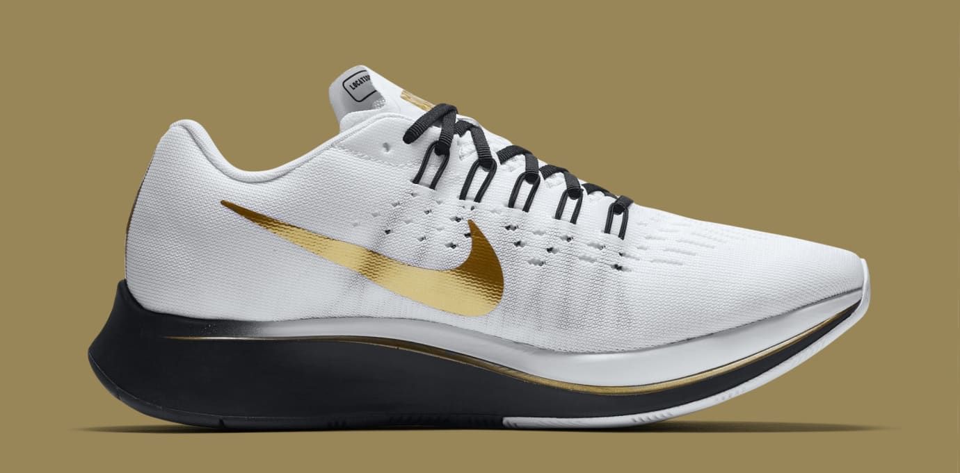 nike zoom fly black white gold