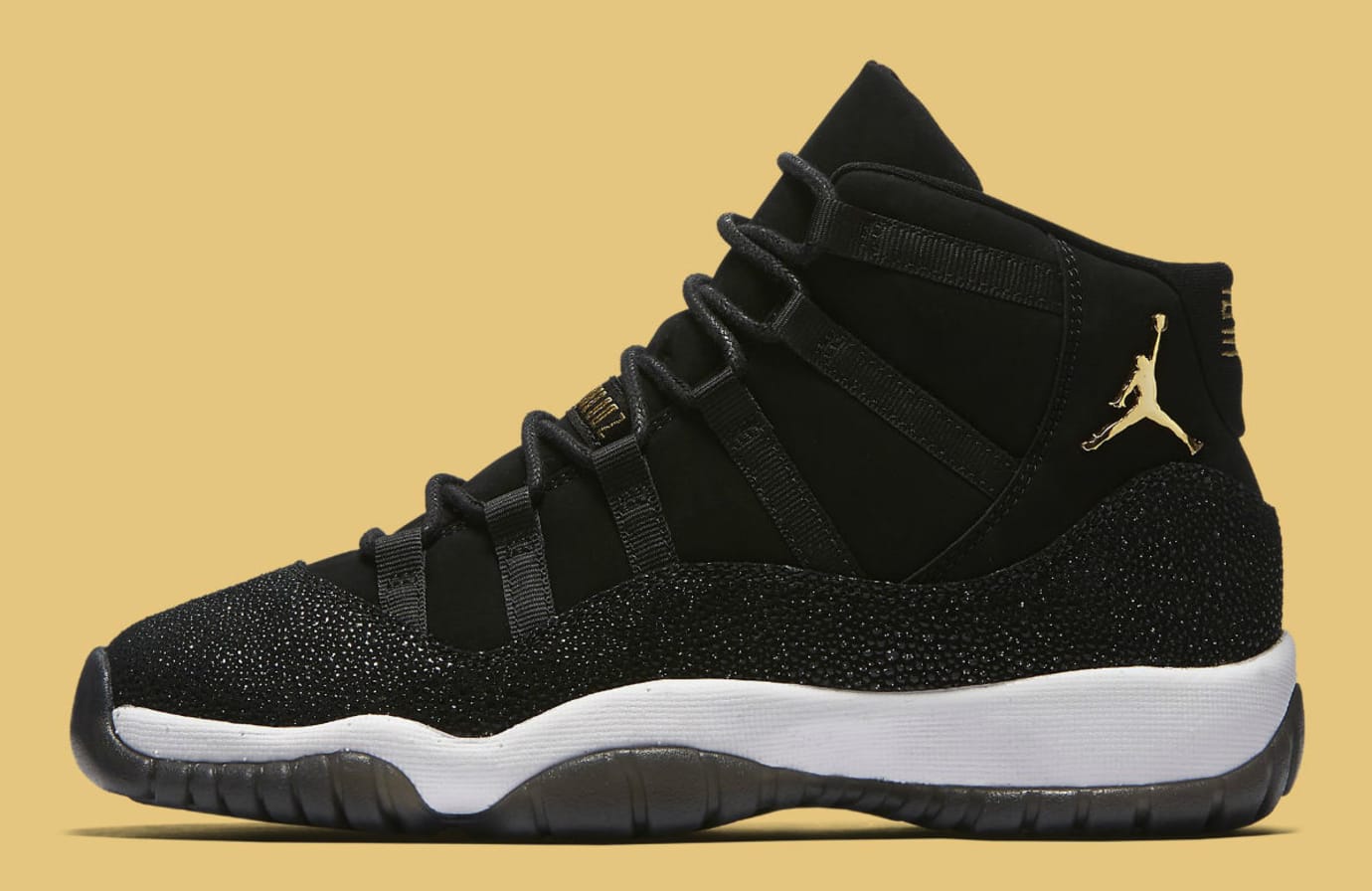 gold and black jordan 11s