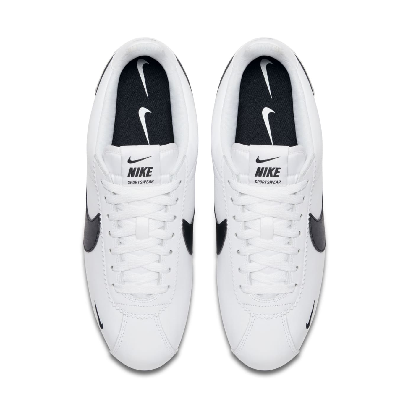 nike cortez leather trainers in white with black swoosh
