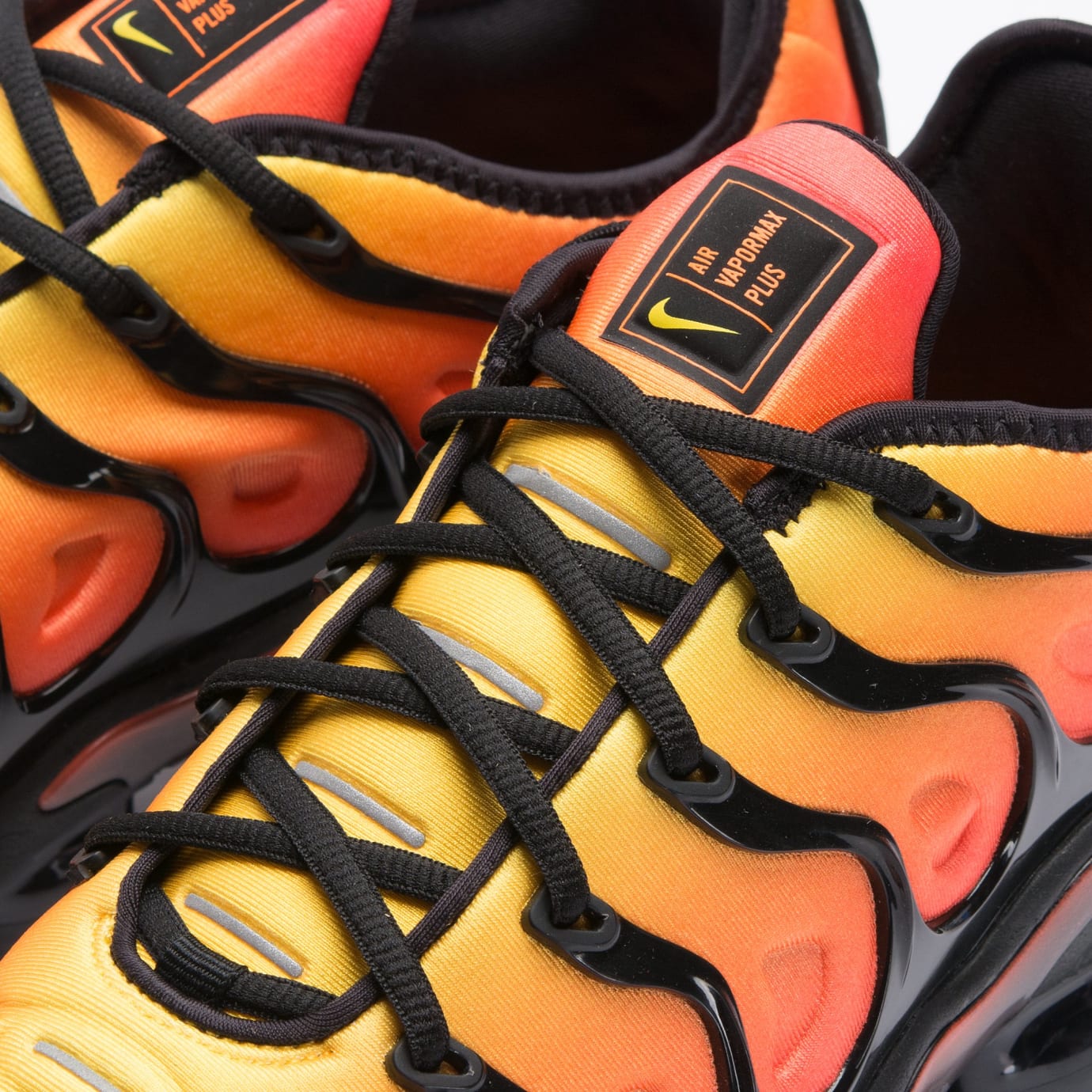 black nike shoes with orange laces