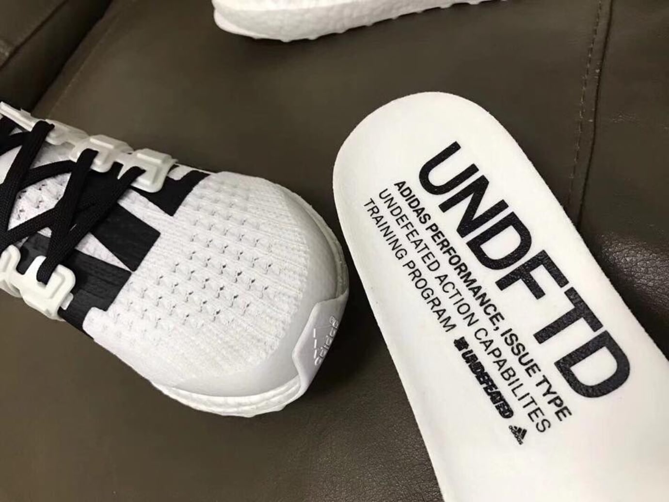 undefeated ultra boost black and white