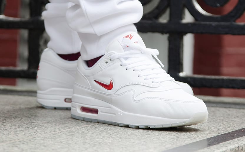 mens white nike shoes with red swoosh