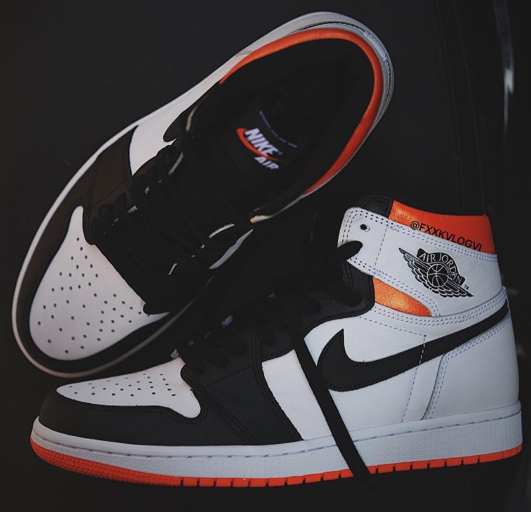 orange black and white jordan 1s