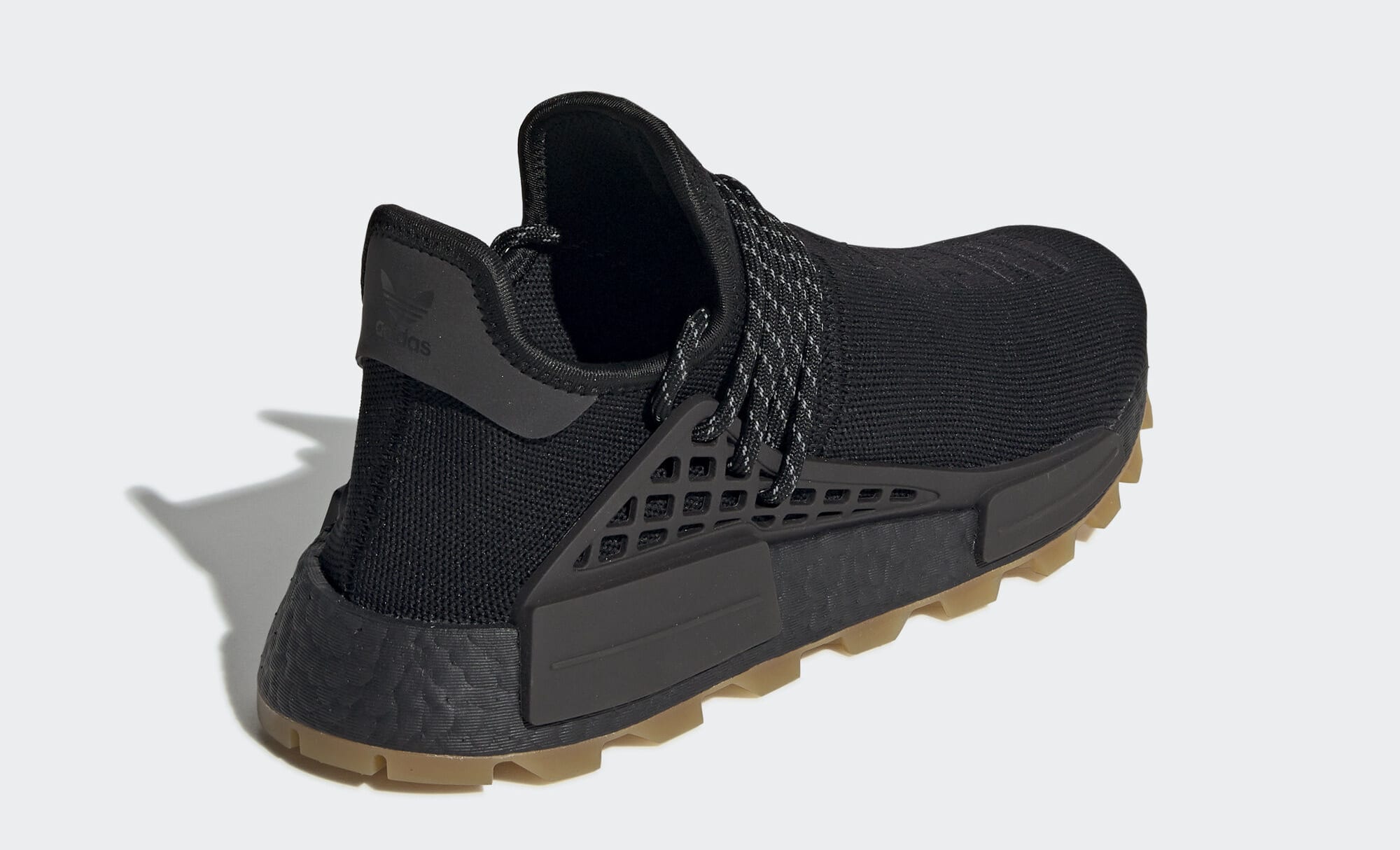 human race nmd black gum sole