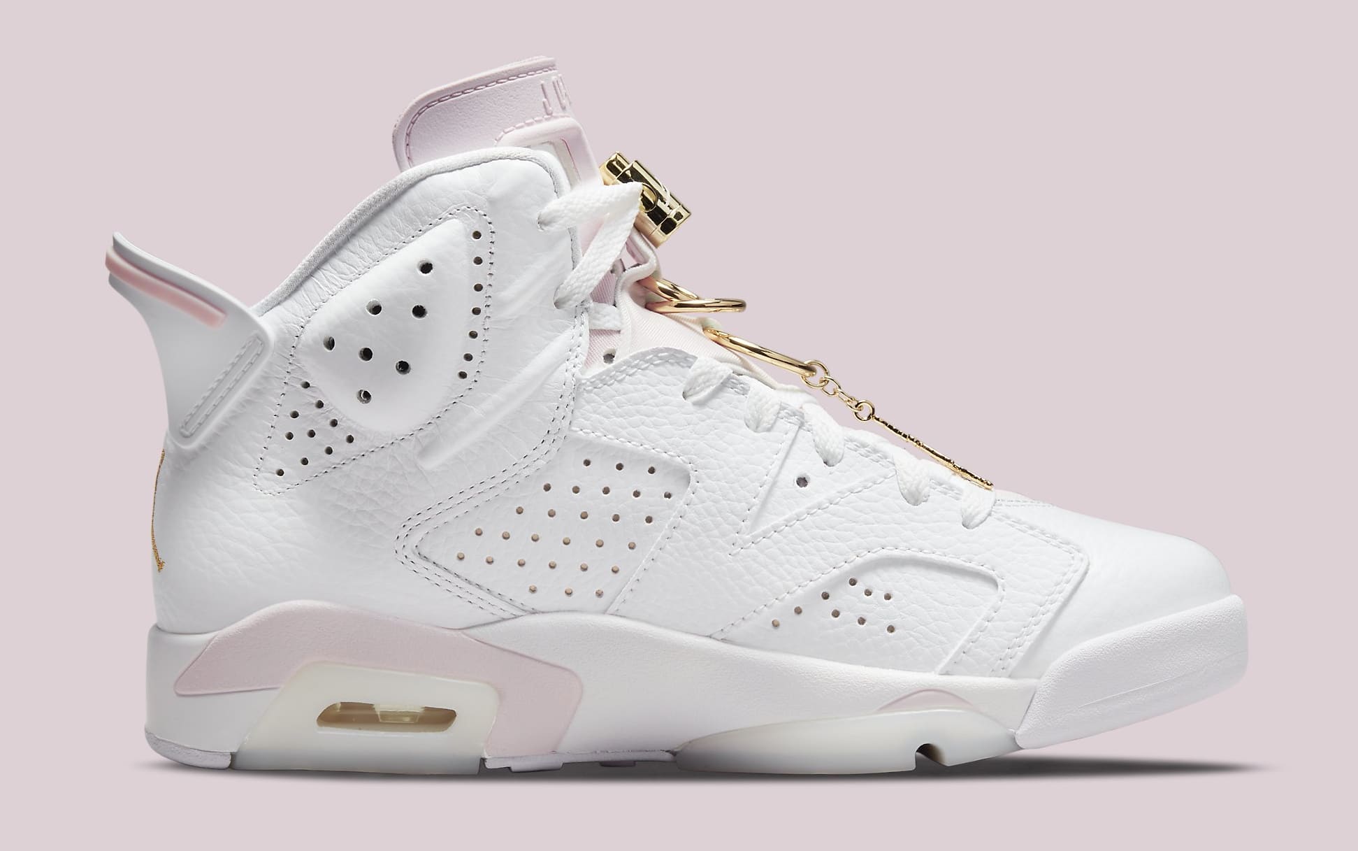 white and pink jordans with gold