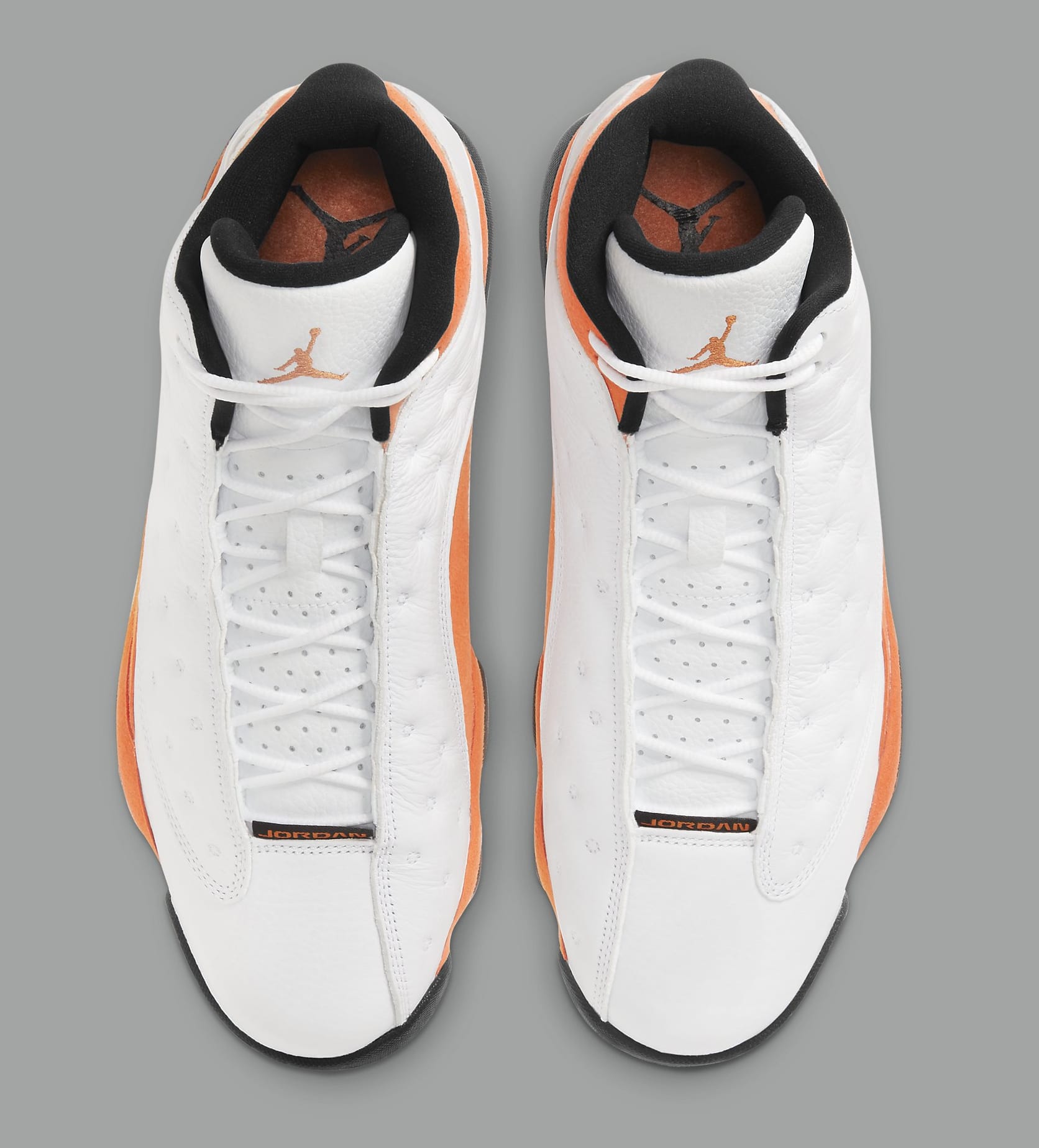 white and orange jordan 13