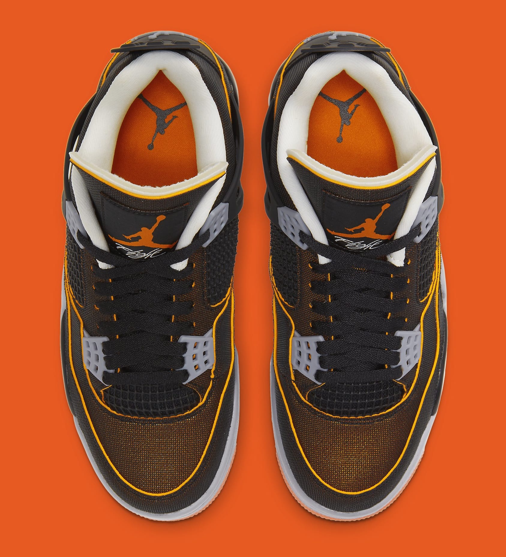 orange and black jordan 4