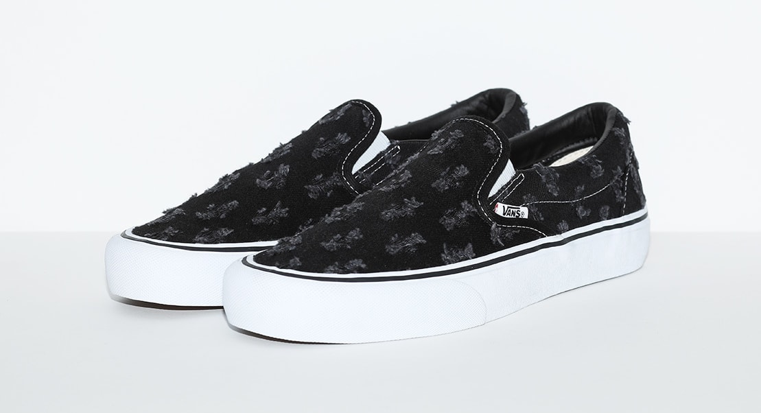 black slip on vans with holes