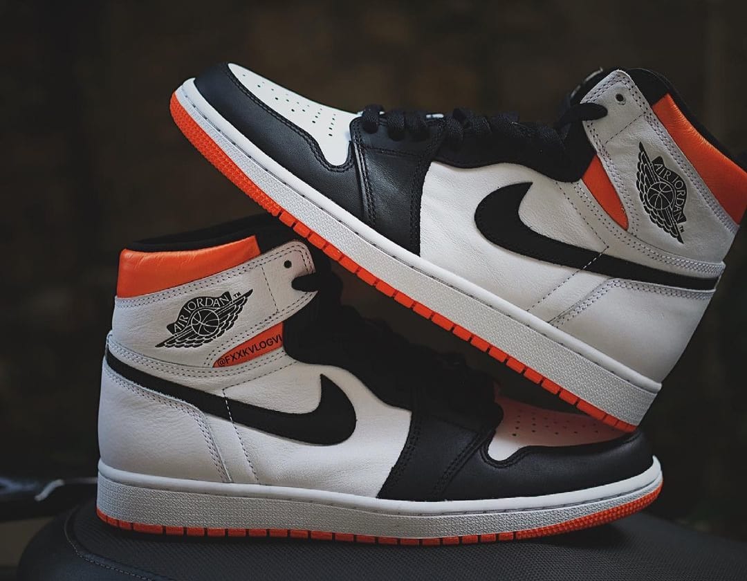 orange black and white jordan 1s