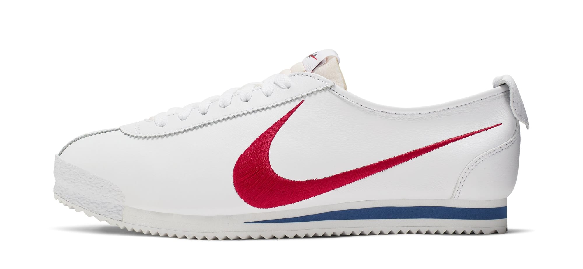 white nike cortez with red swoosh