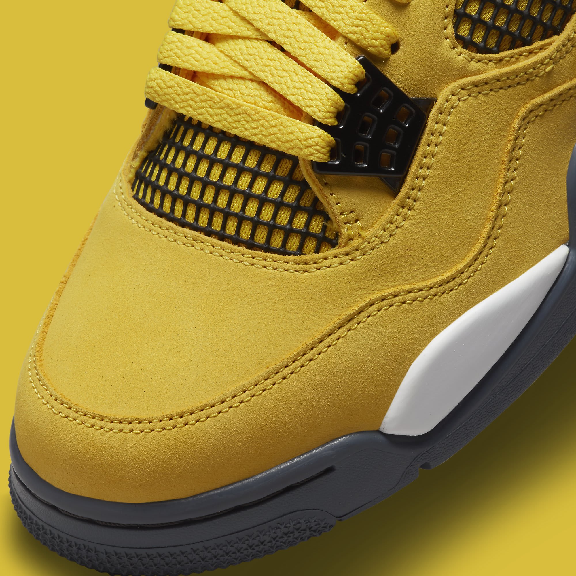 yellow black jordan 4